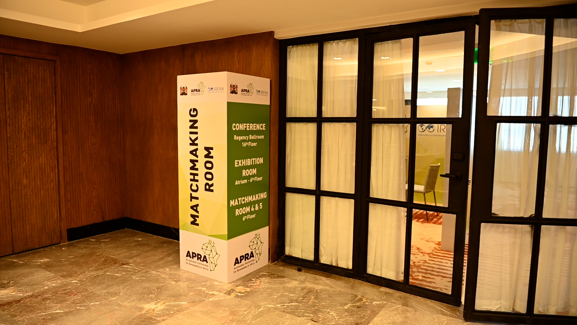 APRA wayfinding sign outside a meeting room