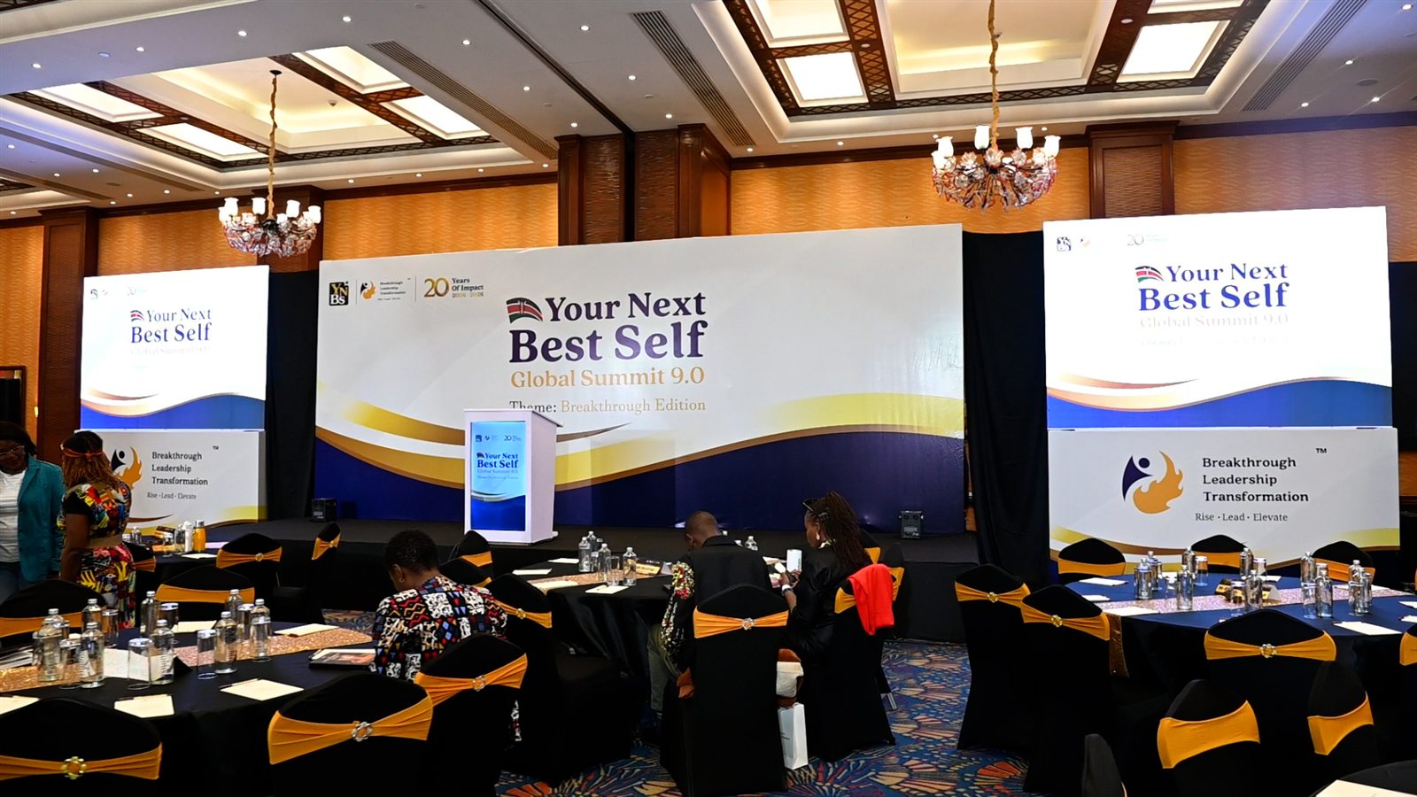 Your Next Best Self Global Summit stage and delegate tables