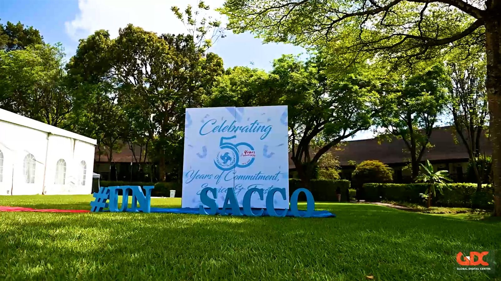 UN SACCO 50th anniversary event signage on a lawn in Nairobi